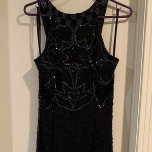 Moon Dancer...Black sequin , beaded long gown. By Jacqueline Lauren. size small.